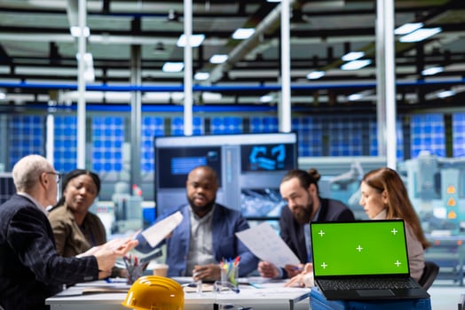 Factory company shareholders analyzing data, reviewing system health metrics with mockup laptop. Industrial plant investors in office troubleshooting issues using chroma key notebook photo
