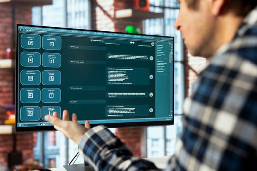 Worker in home office using AI LLM chatbot designed to understand human language. Close up of employee getting help from AI chatbot trained on data enabling him to perform complex tasks photo
