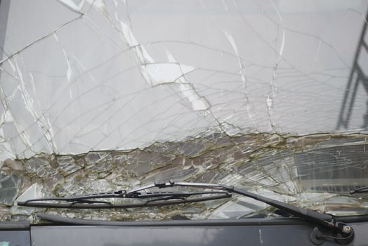 Windshield damage on a bus during a stormy weather event photo