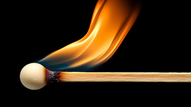 Burning Matchstick Close up on Black Background photo