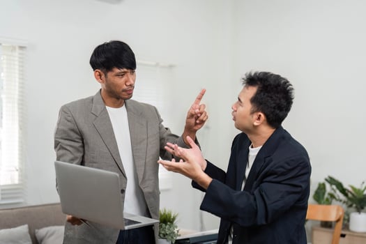 Business Engagement and Strategy Discussion. Two professionals animatedly discussing project outcomes in a contemporary workspace. photo
