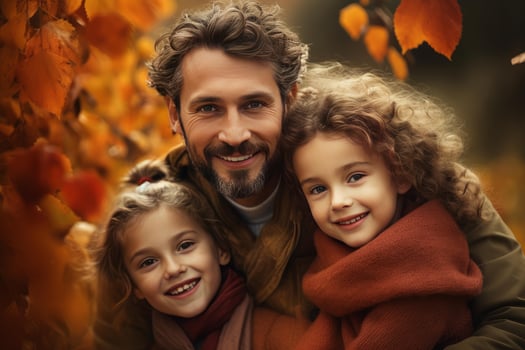 Father embracing daughters in autumn forest, enjoying family time together photo