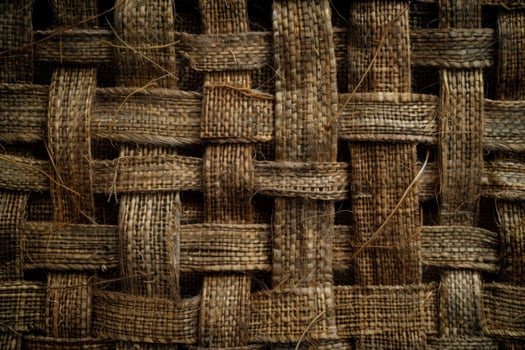 Interlaced fiber weaving creating intricate brown textured pattern photo