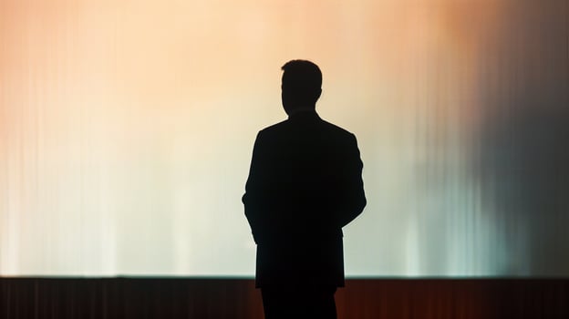 This speaker stands confidently at a podium, preparing for an engaging public address at a conference. photo