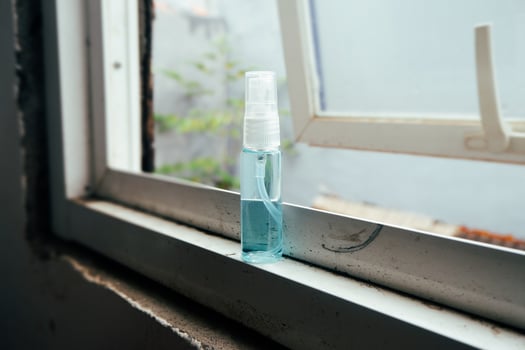 Bottle spray on the window photo