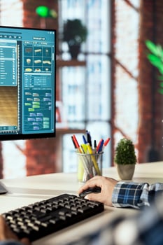 Interior designer uses architectural software to generate virtual photorealistic image renderings. Man preparing visual preview for customers after designing room with 3D modeling application photo