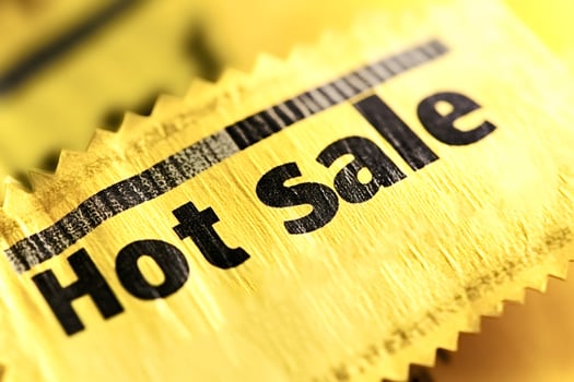 Hot sale sign promoting huge discounts and bargains photo