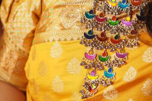 Colorful jewelry adorns traditional attire during cultural celebration photo