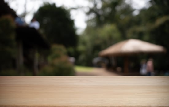 Empty wood table and blur of restaurant background selective focus product display photo
