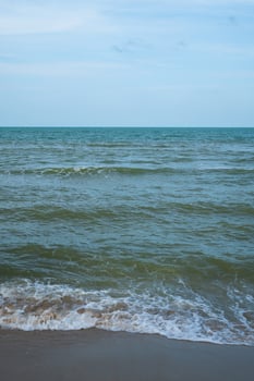 Panorama sea view vertical horizon beautiful nature ocean wave surface and blue sky background in day time photo