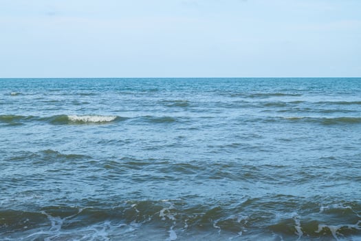 Panorama sea view wide horizon beautiful nature ocean wave surface water and blue sky background in day time photo