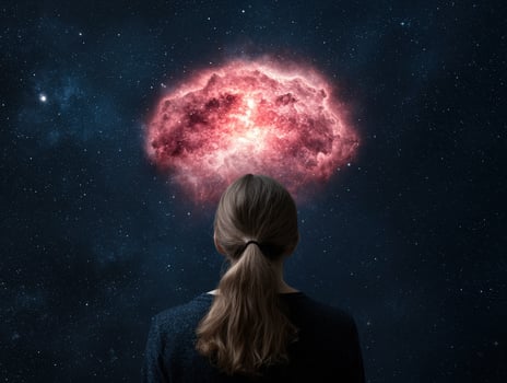Woman gazing at a cosmic nebula in space photo