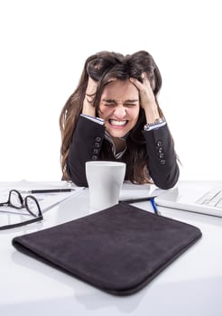 Stressed business girl pulling her hair photo