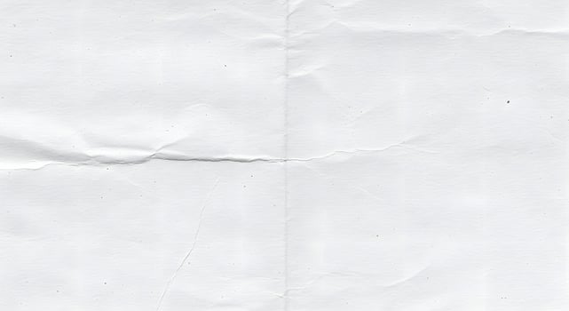 A piece of white paper with a small hole photo