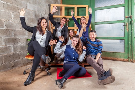 a team of young business people waving in a relaxing moment in the office photo
