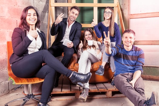 a group of young business people showing the peace sign a moment of relaxation indoors photo