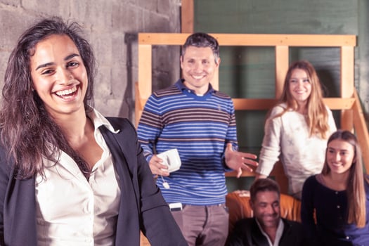 a group of smiling young professional business people on a work break in a modern office. photo