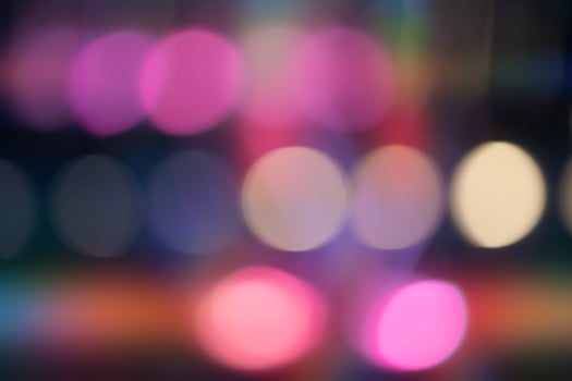 A blurry image of a group of colorful circles. The circles are of different sizes and colors photo