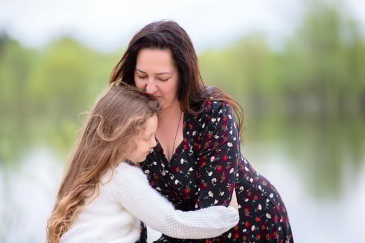 Mom and daughter enjoy a walk in the park on Mother's Day. photo