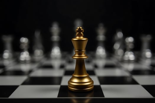 Golden king chess piece standing alone on a chessboard representing strategy and leadership photo