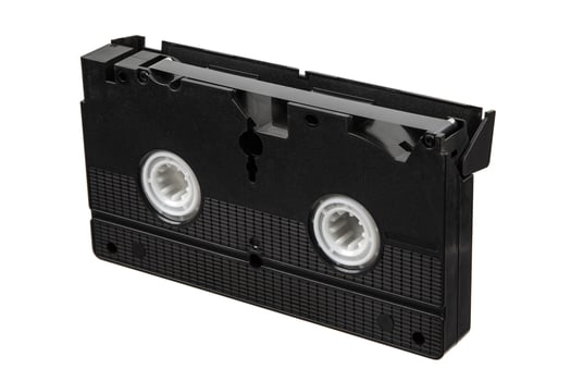 Old black VHS tape isolated on white background photo