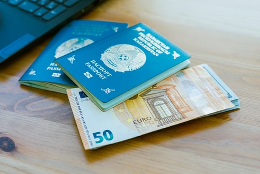 Passport and money on a wooden table photo