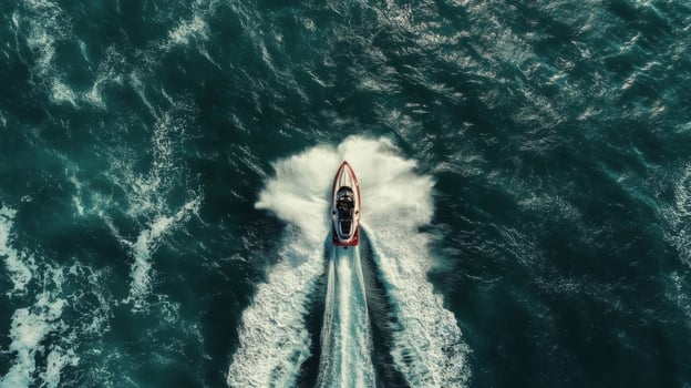 Red and White Jet Ski Speeding Across Dark Blue Ocean Waters photo
