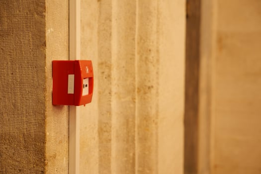 Fire alarm box mounted on a wall in a public building photo