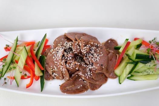 Liver cucumber peppers Tasty fried chicken liver with onion and parsley isolated on white photo