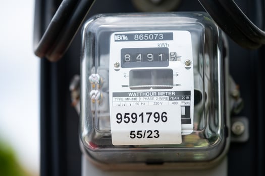 Electric measuring power meter for energy cost at home and office. photo
