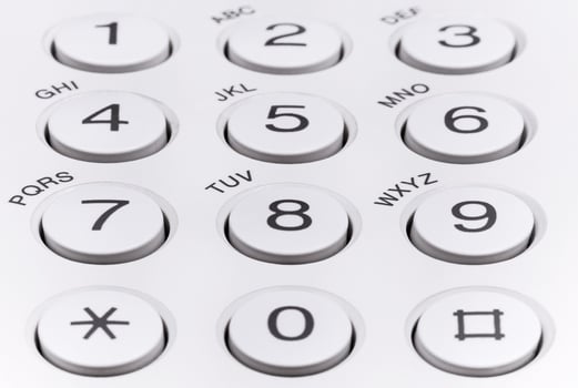 Round plastic buttons with numbers on office equipment photo