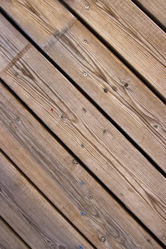 Top view of wooden floor texture. Diagonal wooden planks with screw marks, nail heads typical for boardwalk or pier flooring 15 photo