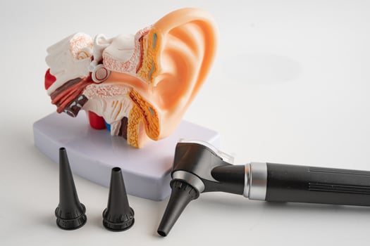 Otoscope for audiologist or ENT doctor use otoscope checking ear and treat hearing loss problem. photo