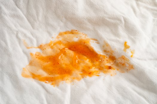 Dirty tomato sauce stain or ketchup on cloth photo