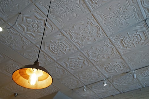 Interior design and ceiling decoration decorated with Thai style gypsum whiteboard and hanging metal lamps photo