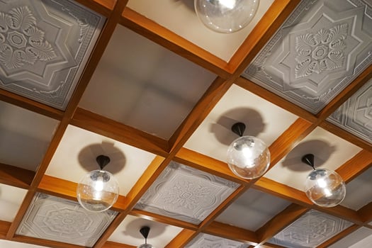 Interior design and decoration decorated with Thai style gypsum whiteboard and hanging metal lamps and wooden frame photo