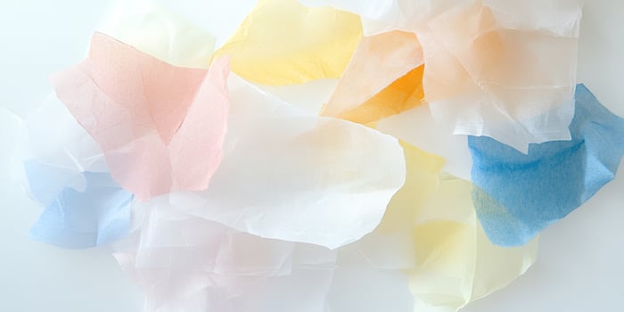 Colorful layers of translucent tissue paper with pastel hues photo
