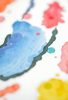 close up of a piece of paper with paint splattered on it photo