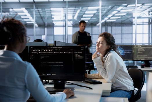 Data center computer scientist developing disaster recovery plans ensuring minimal downtime. Server room employee uses data analytics to monitor performance and predict future infrastructure needs photo