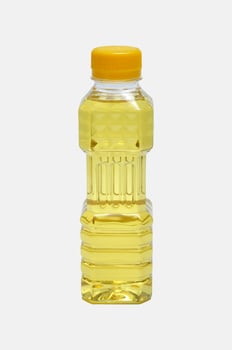 Palm cooking oil in a plastic bottle white background photo