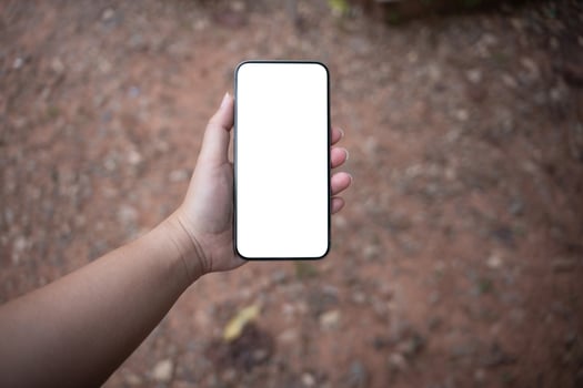 Women hands holding smartphone blank copy space screen smartphone blank white screen isolated technology concept. photo