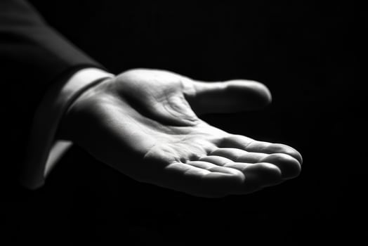 Elegant black and white image of an outstretched hand inviting connection or assistance photo