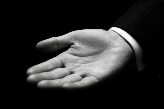 Elegant hand gesture in a formal setting, showcasing readiness for interaction photo