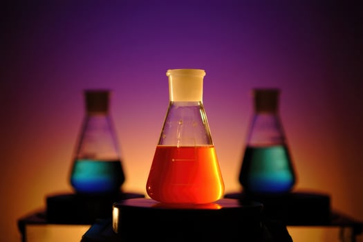 Colorful chemical reaction in laboratory beakers during scientific experimentation photo