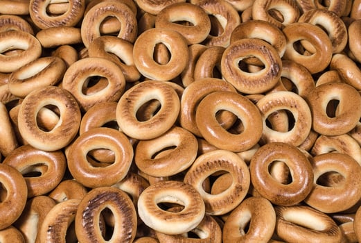Small baked bagels background photo