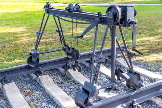 A large metal crane on a train track photo