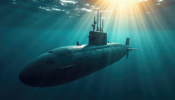 A submarine in the ocean with sunlight shining down photo