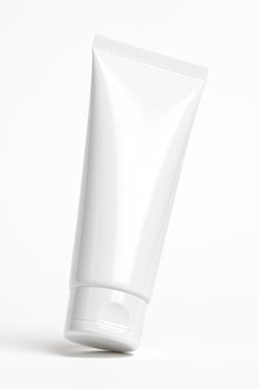 Glossy White Plastic Tube in Low Angle View for Toothpaste on Clean White Background photo