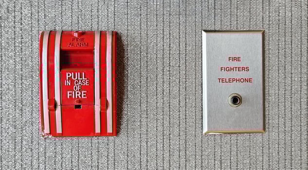 Fire alarm switch box and firefighter telephone port for connect or calling on gray background Device or tool for pull out in case of fire and prevent emergency event and Protect concept. photo