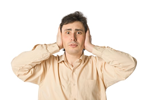 Man covering his ears with his hands photo